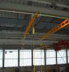 Rail mounted overhead fall arrest systems provide cover for the whole hanger